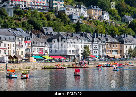 Paddle boats with tourists on the Semois river in the city Bouillon in summer, Luxembourg Province, Belgian Ardennes, Belgium Stock Photo