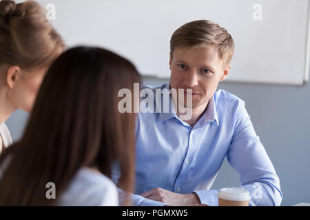 Diverse millennial colleagues have talk during office break Stock Photo