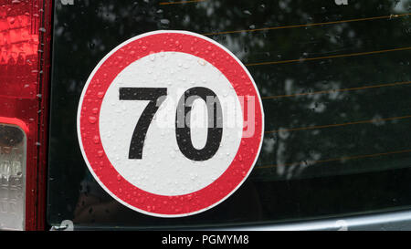 speed limit sign on the young driver's car Stock Photo