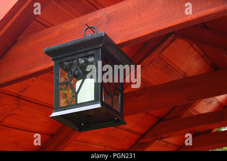 Hanging, black lantern on the wood Stock Photo