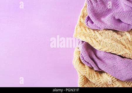 Violet white wool knitting texture.  Sweater textile background. Top view. Flat lay Stock Photo
