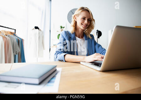 Fashion designer working on her designs in the studio