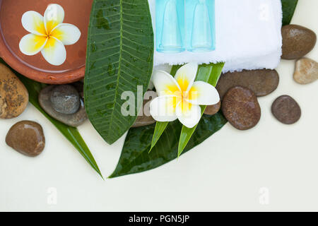 Top view of spa objects and stones for massage treatment on background with copy space. Stock Photo