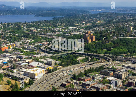 Aerial view of the Interstate 5 expressway in Seattle, the International District, Atlantic, North Beacon Hill, Mt Baker and Lake Washington, USA. Stock Photo