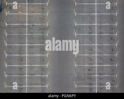 Asphalt floor with parking lot at city center, vacant parking lot. Parking lane painting on floor with numbered places. Stock Photo