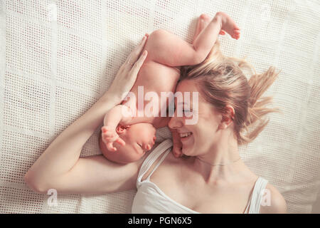 happy motherhood concept - happy mother and newborn baby
