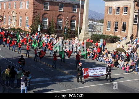 School marching band in old fashioned Christmas parade in the city of Bedford, VA, USA Stock Photo