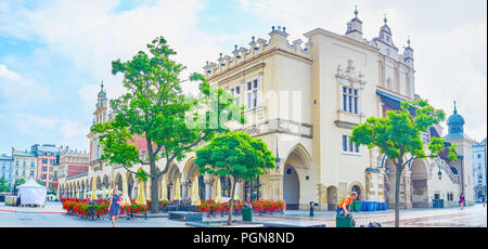 KRAKOW, POLAND - JUNE 11, 2018: Panoramic view on beautiful Sukiennice, the historical trading center in the middle of Main Market Square, on June 11  Stock Photo