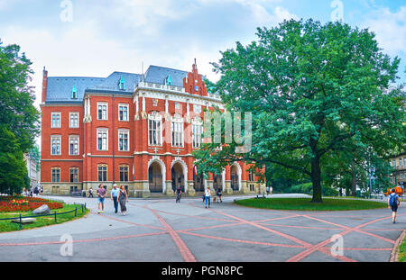 KRAKOW, POLAND - JUNE 11, 2018: The frontage of Collegium Novum, that is the most beautiful and the oldest building of Jagiellonian University, on Jun Stock Photo