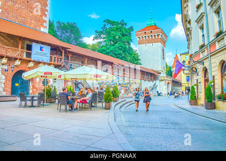 KRAKOW, POLAND - JUNE 11, 2018: The adjoining territory to Florian Gates is the place where possible to enjoy paintings of local artists at outdoor ar Stock Photo