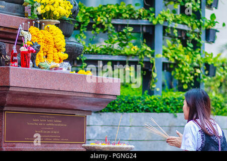 Bangkok, Thailand - February 22, 2017: Unidentified woman is praying to black Brahma worship ceremony at the Empire Tower, Sathorn Junction Road, Bang Stock Photo