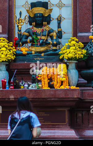 Bangkok, Thailand - February 22, 2017: Unidentified woman is praying to black Brahma worship ceremony at the Empire Tower, Sathorn Junction Road, Bang Stock Photo