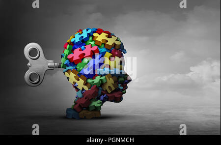 Autism therapy concept as a group of puzzle pieces shaped as a head of a child as an autistic icon for mental disorder idea. Stock Photo