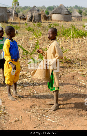 GHANI, GHANA - JAN 14, 2017: Unidentified Ghanaian children walk in the Ghani village. Ghana children suffer of poverty due to the bad economy. Stock Photo