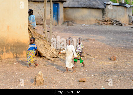 DAGOMBA VILLAGE, GHANA - JAN 14, 2017: Unidentified Dagomban children walk in the local village. Dagombas are ethnic group of Northern Ghana Stock Photo