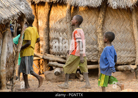 DAGOMBA VILLAGE, GHANA - JAN 14, 2017: Unidentified Dagomban children walk in the local village. Dagombas are ethnic group of Northern Ghana Stock Photo