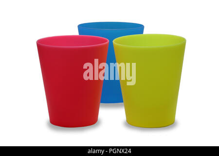 Colorful plastic cups red blue yellow on isolated white background Stock Photo