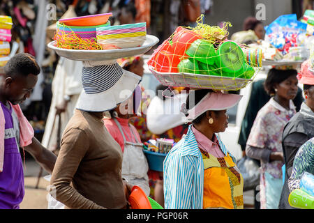 Women carry basins and goods on head bush road The Gambia Stock Photo ...