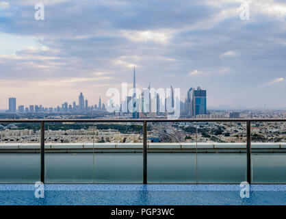 Rooftop swimming pool with city skyline, Dubai, United Arab Emirates Stock Photo