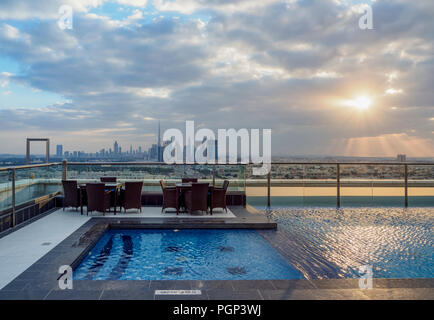 Rooftop swimming pool with city skyline, Dubai, United Arab Emirates Stock Photo