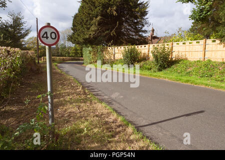 40 mph speed limit sign painted on a road in the New Forest National ...