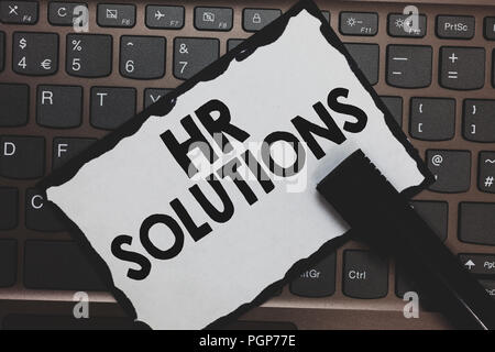 Handwriting text Hr Solutions. Concept meaning Outsourced Human resources consultancy and support Experts White paper keyboard Inspiration communicate Stock Photo