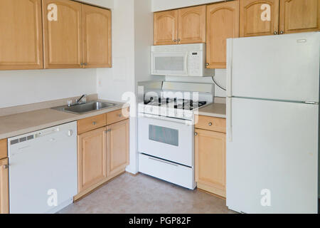 Small modular kitchen in a condominium unit (empty kitchen) - USA Stock Photo