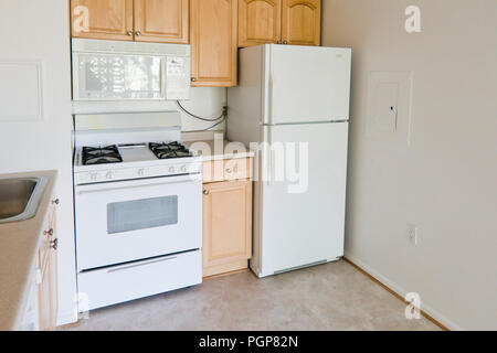 Small modular kitchen in a condominium unit (empty kitchen) - USA Stock Photo