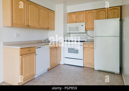 Small modular kitchen in a condominium unit (empty kitchen) - USA Stock Photo