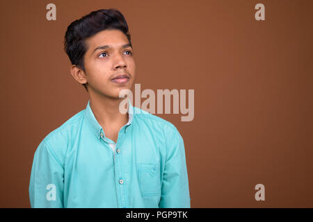 Young Indian boy wearing blue shirt 