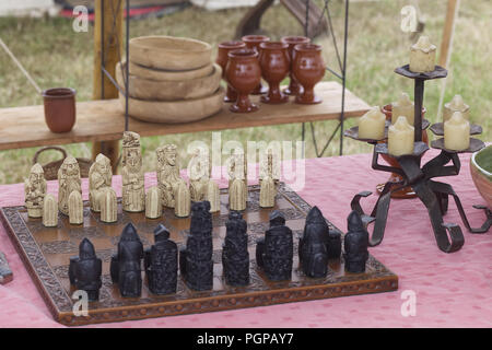 Medieval chess set on a banquet table Stock Photo