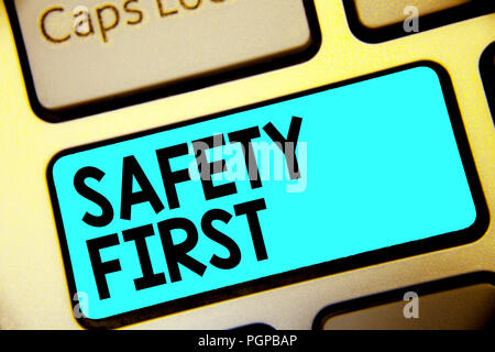Writing note showing Safety First. Business photo showcasing Avoid any unnecessary risk Live Safely Be Careful Pay attention Keyboard blue key Intenti Stock Photo