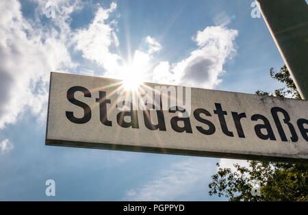 Bad Vilbel, Germany. 28th Aug, 2018. The sun shines behind the street sign of 'Stadastrasse' at the headquarters of the drug manufacturer Stada. Credit: Frank Rumpenhorst/dpa/Alamy Live News Stock Photo