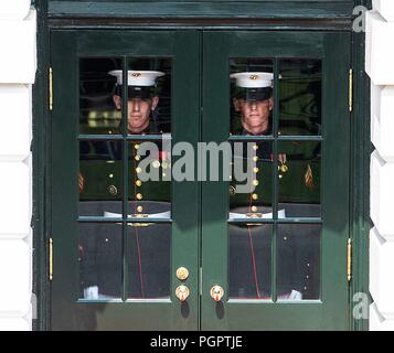 Washington, District of Columbia, USA. 27th Aug, 2018. U.S. Marines prepare to open the doors for U.S. President Donald Trump and first lady Melania Trump as the couple welcomed Kenyan President Uhuru Kenyatta to the White House. Credit: Ron Sachs/CNP/ZUMA Wire/Alamy Live News Stock Photo
