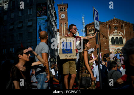 Milan, Italy. 28th Aug 2018. A young man holds a placard reading 'Is this the Europe we want?' during a protest called 'Europe without borders' against the meeting between Prime Minister of Hungary, Viktor Orbán and Italian Interior Minister Matteo Salvini in Milan, Italy on August 28, 2018 Credit: Piero Cruciatti/Alamy Live News Stock Photo