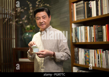 Mature man drinking tea Stock Photo