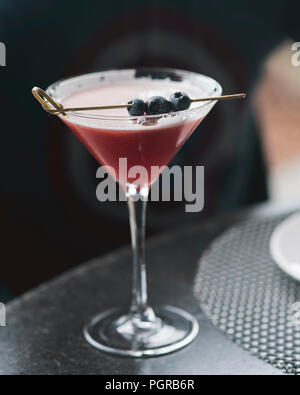 Enjoying a delicious blueberry cocktail on the patio of the Chatham Bars Inn Stock Photo