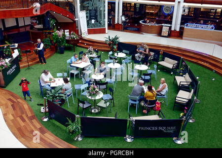 Live musical background entertainment in the central courtyard of Princes Square in Buchanan Street, Glasgow Stock Photo