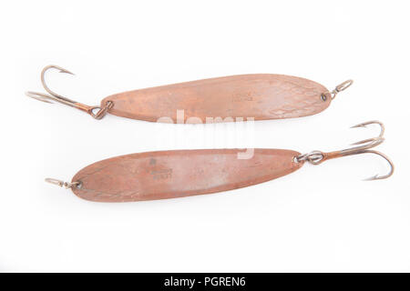 An example of a vintage fishing lure equipped with treble hooks, possibly  made by Woods Mfg, displayed on an old fishing bag. Lures such as these are  Stock Photo - Alamy