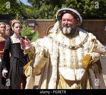 KIng Henry Eigth and courtiers (played by actors at Hamton Court Place London) Stock Photo