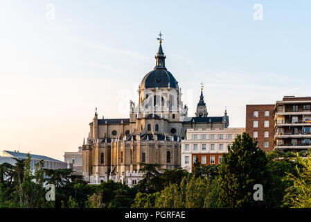 Skyline of Almudena Cathedral of Madrid. Exterior view from Vistillas Park at sunset Stock Photo