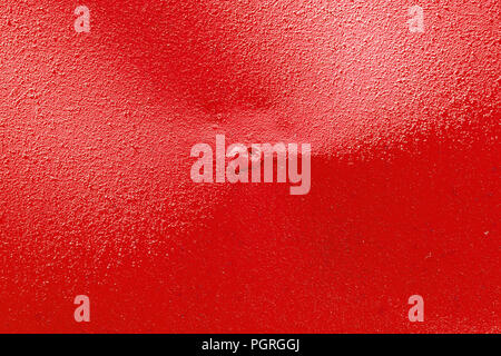 Red painted surface of the wall.  Texture of plastered wall. Abstract decorative background. Template for design Stock Photo