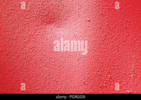 Red painted surface of the wall.  Texture of plastered wall. Abstract decorative background. Template for design Stock Photo