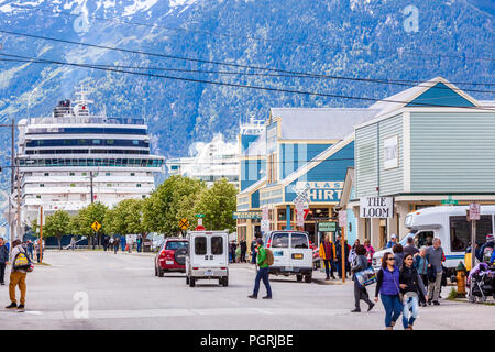 Cruise liners in the harbour very close to the tourist shops in the main street in Skagway, Alaska USA Stock Photo