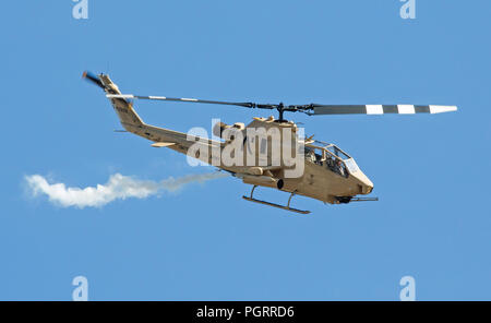 MONROE, NC - NOVEMBER 11, 2017:  An AH-1F Cobra attack helicopter performing at the Warbirds Over Monroe Air Show in Monroe, NC. Stock Photo