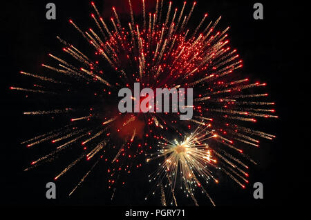 Amazing red-white firework on dark background Stock Photo