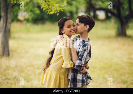 Little boy kissing girl. Stock Photo