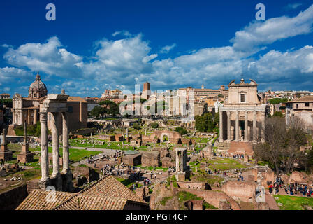 Sightseeing in Rome. Tourists visit Roman Forum ancient ruins Stock Photo