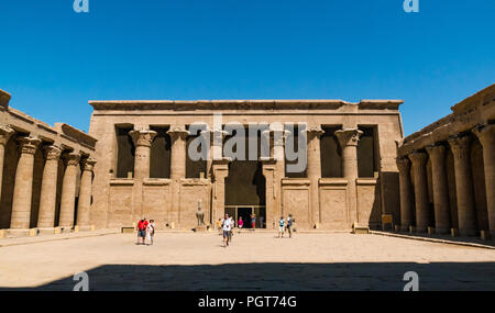 Tourists in court of offerings inner courtyard, Temple of Edfu, Edgu, Egypt, Africa Stock Photo