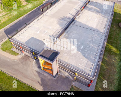 modern multilevel car parking building in residential area. aerial view Stock Photo